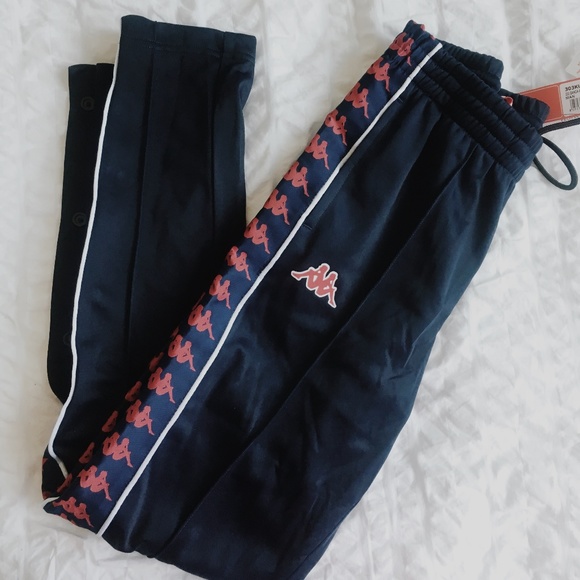 navy blue and red track pants
